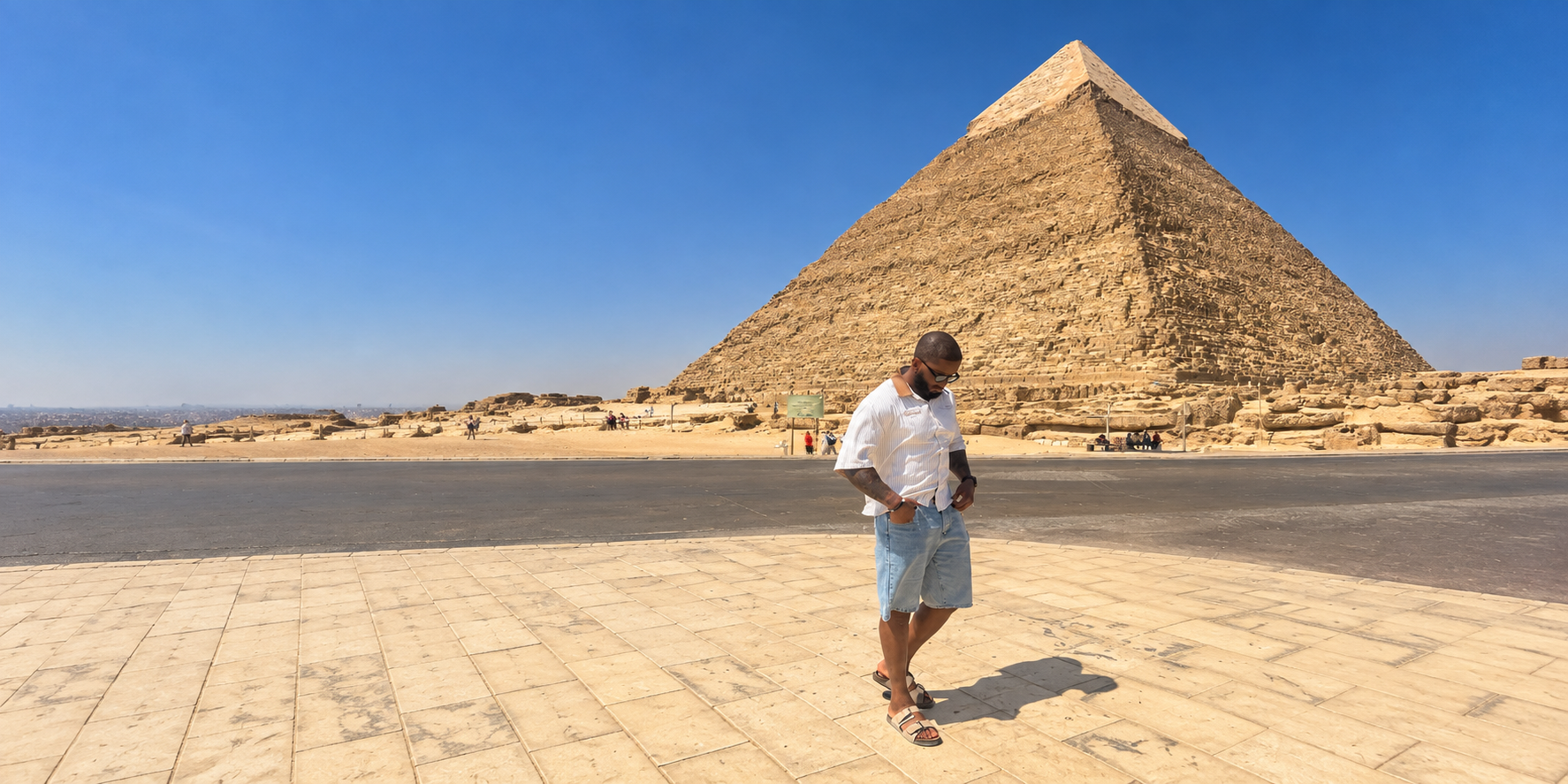 Dele walking in front of the Pyramid of Khafre at Giza
